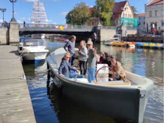 An electric boat designed and built in Klaipeda performes a test on the Dane river